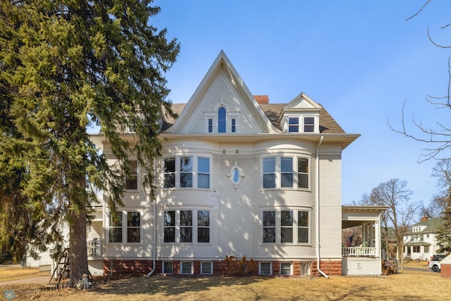 back of house featuring covered porch