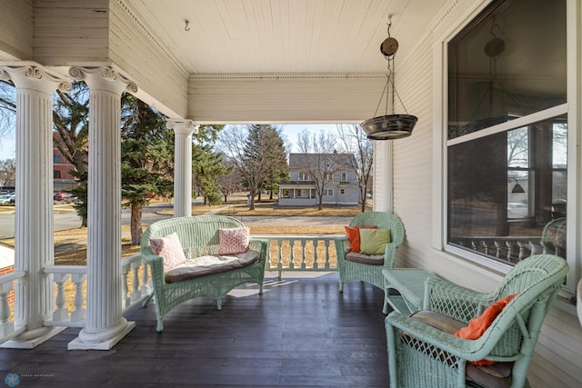 wooden terrace with a porch