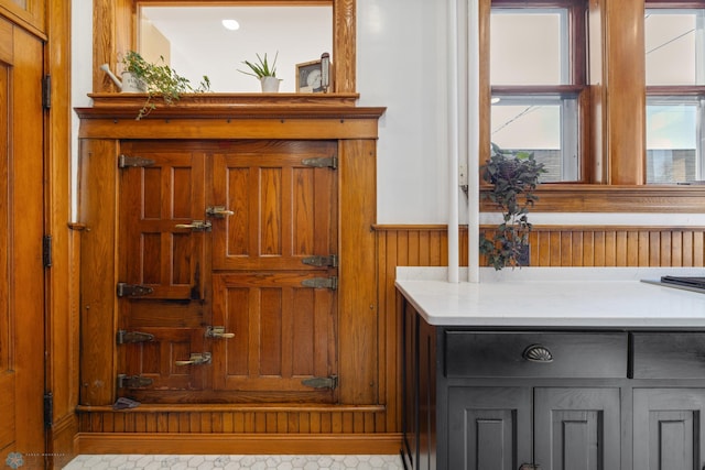 interior space featuring a wainscoted wall