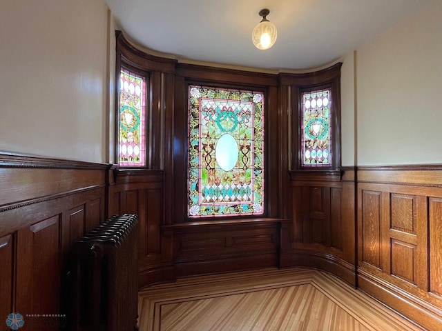 details featuring radiator and wainscoting