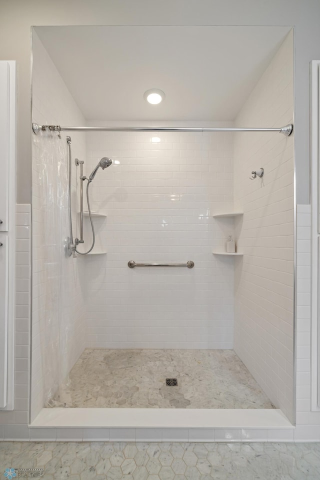 bathroom with a shower stall