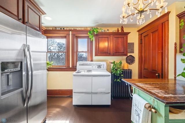 kitchen featuring stainless steel fridge with ice dispenser, white electric range oven, dark countertops, dark wood-type flooring, and an inviting chandelier