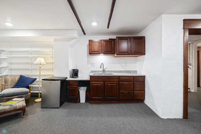 kitchen with carpet floors, a sink, recessed lighting, and freestanding refrigerator