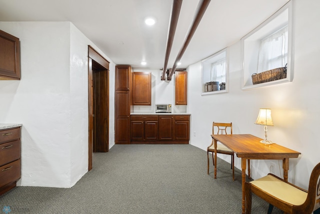 interior space with a toaster, light colored carpet, and recessed lighting
