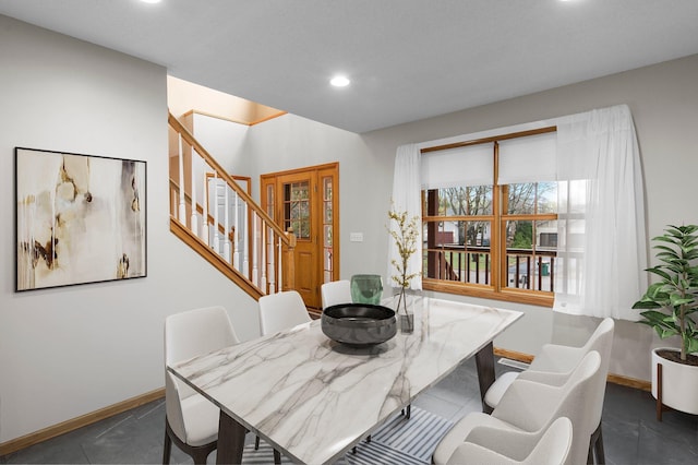 dining space with recessed lighting, baseboards, and stairway