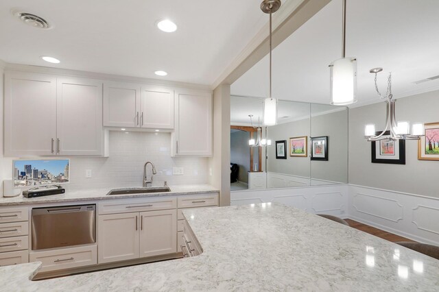 8651 Basswood Rd Unit 203, Eden Prairie, MN 55344 - kitchen featuring a wainscoted wall, visible vents, an inviting chandelier, ornamental molding, and a sink