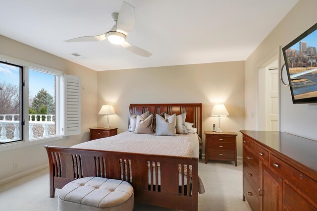 8651 Basswood Rd Unit 203, Eden Prairie, MN 55344 - bedroom featuring light carpet, visible vents, baseboards, and ceiling fan