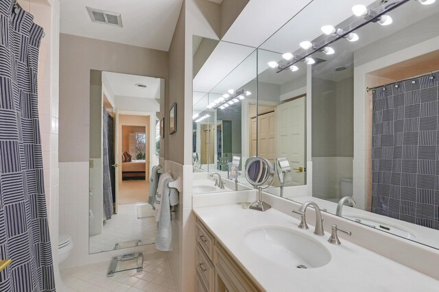 8651 Basswood Rd Unit 203, Eden Prairie, MN 55344 - ensuite bathroom featuring visible vents, toilet, ensuite bathroom, tile patterned floors, and vanity