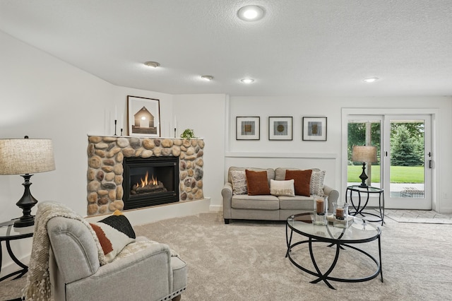 27901 Teale Ave, New Prague, MN 56071 - carpeted living area featuring a fireplace, a textured ceiling, and recessed lighting