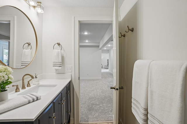 27901 Teale Ave, New Prague, MN 56071 - bathroom with vanity, recessed lighting, and baseboards