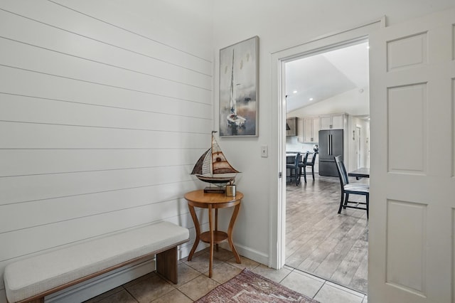 27901 Teale Ave, New Prague, MN 56071 - corridor featuring vaulted ceiling, baseboards, and light tile patterned floors