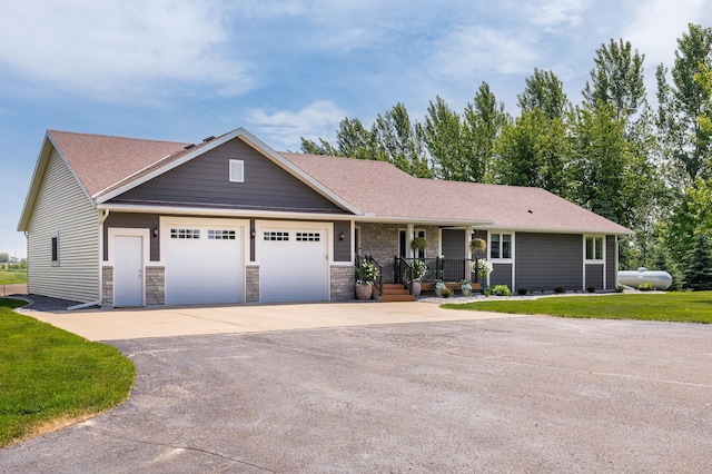 27901 Teale Ave, New Prague, MN 56071 - view of front facade with an attached garage, driveway, a porch, roof with shingles, and a front lawn