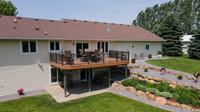 27901 Teale Ave, New Prague, MN 56071 - back of house featuring a yard, a patio area, a wooden deck, outdoor dining space, and a shingled roof