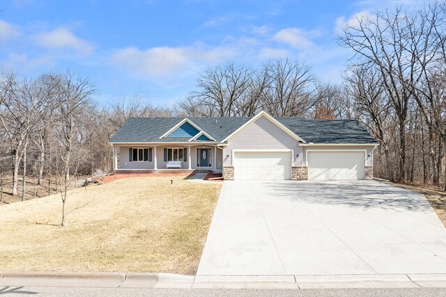 single story home featuring a shingled roof, a front lawn, a garage, stone siding, and driveway
