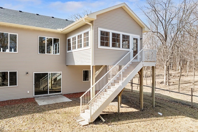 19611 Flamingo St NW, Oak Grove, MN 55011 - rear view of property featuring stairs and roof with shingles