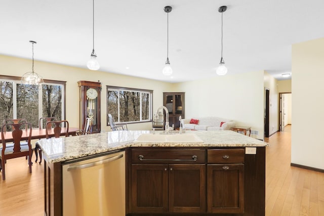 19611 Flamingo St NW, Oak Grove, MN 55011 - kitchen with stainless steel dishwasher, a sink, dark brown cabinetry, and light wood finished floors