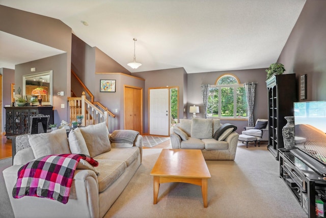 6875 148th Ln NW, Ramsey, MN 55303 - living room featuring lofted ceiling, stairs, and light colored carpet