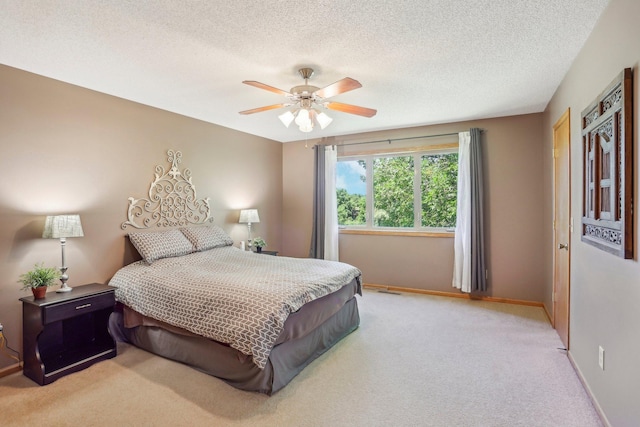 6875 148th Ln NW, Ramsey, MN 55303 - bedroom featuring light colored carpet, baseboards, ceiling fan, and a textured ceiling