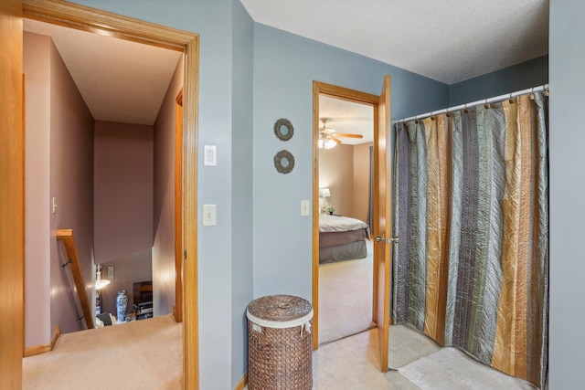 6875 148th Ln NW, Ramsey, MN 55303 - ensuite bathroom featuring a shower with shower curtain and a textured ceiling