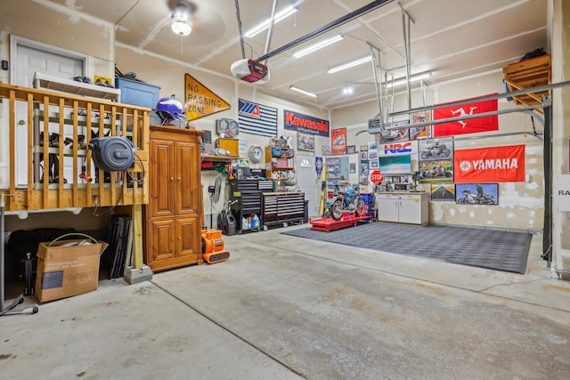 6875 148th Ln NW, Ramsey, MN 55303 - garage with a garage door opener and a workshop area