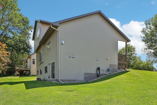 6875 148th Ln NW, Ramsey, MN 55303 - view of side of property featuring a lawn and a deck