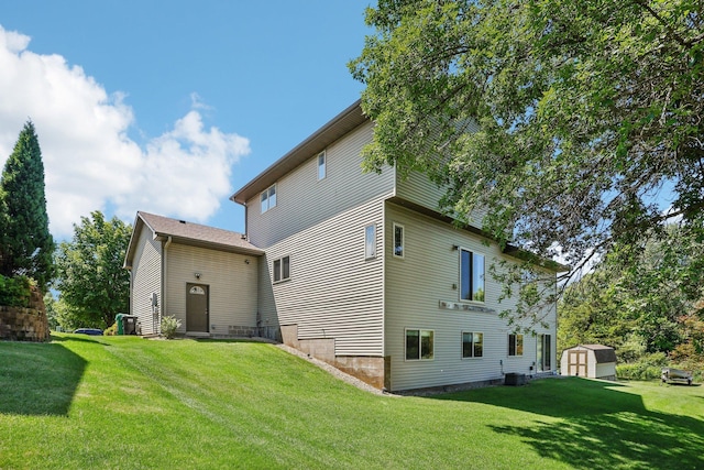 6875 148th Ln NW, Ramsey, MN 55303 - back of property with a yard and central AC