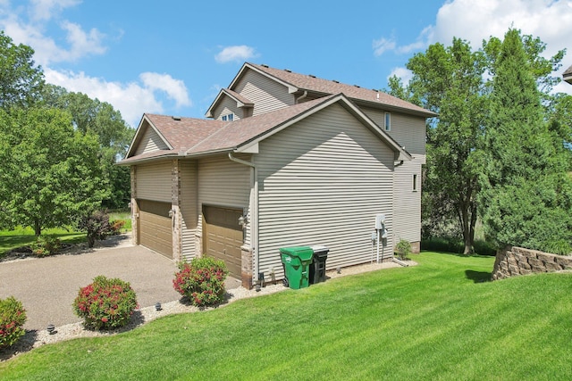 6875 148th Ln NW, Ramsey, MN 55303 - view of property exterior featuring driveway, a shingled roof, and a lawn
