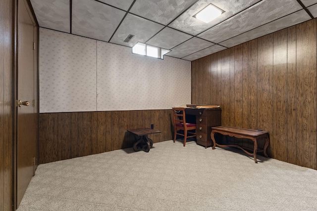 interior space with visible vents, wallpapered walls, wooden walls, carpet, and wainscoting