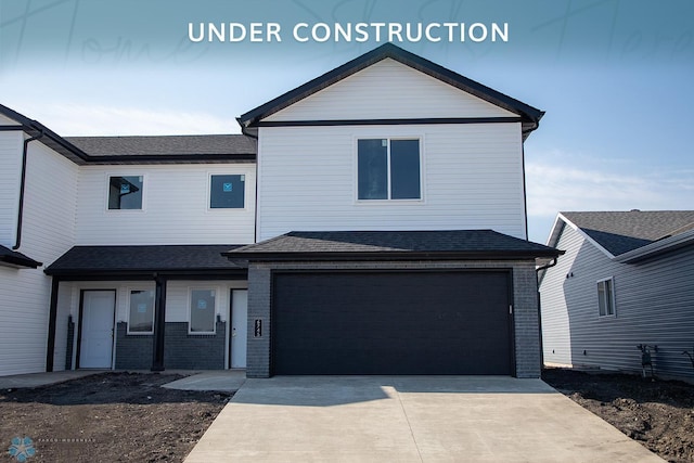 6745 Meadow View Dr S, Fargo, ND 58104 - view of front of home with concrete driveway, brick siding, and a garage