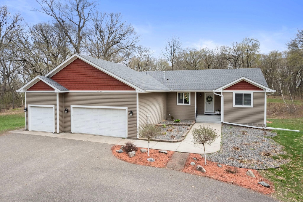 25377 Eureka Ave, Wyoming, MN 55092 - single story home featuring a garage, asphalt driveway, and a shingled roof