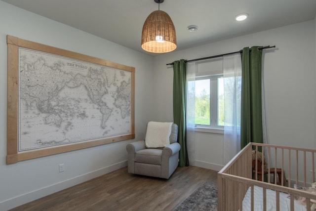 38525 Northstar Dr, Cushing, MN 56443 - bedroom featuring baseboards, a nursery area, and wood finished floors