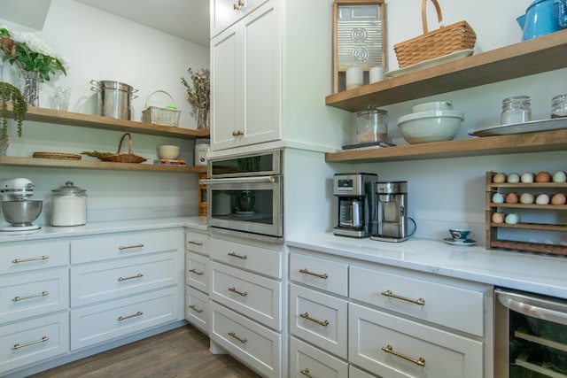38525 Northstar Dr, Cushing, MN 56443 - kitchen featuring open shelves, wine cooler, dark wood-style floors, and stainless steel oven