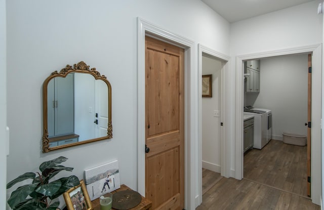 38525 Northstar Dr, Cushing, MN 56443 - hallway with baseboards, separate washer and dryer, and dark wood finished floors
