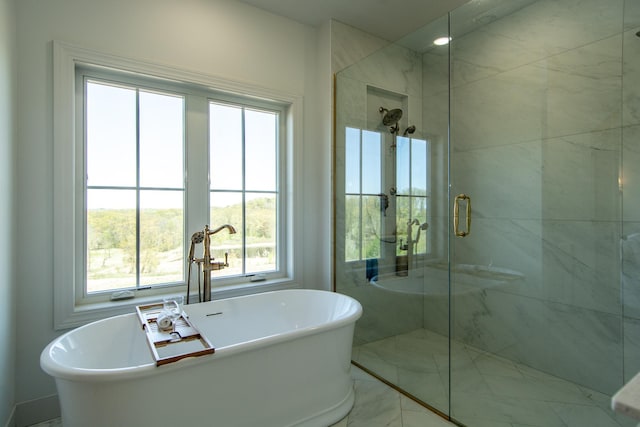 38525 Northstar Dr, Cushing, MN 56443 - bathroom with a freestanding tub, marble finish floor, and a shower stall