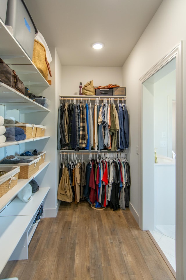 38525 Northstar Dr, Cushing, MN 56443 - walk in closet featuring wood finished floors