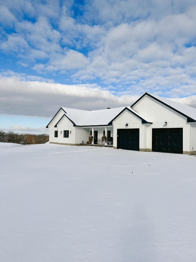 38525 Northstar Dr, Cushing, MN 56443 - view of front of home featuring board and batten siding and a garage