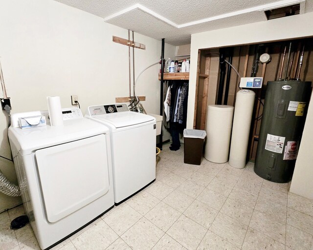 7331 175th Ave NW, Ramsey, MN 55303 - laundry room with electric water heater, independent washer and dryer, and a textured ceiling
