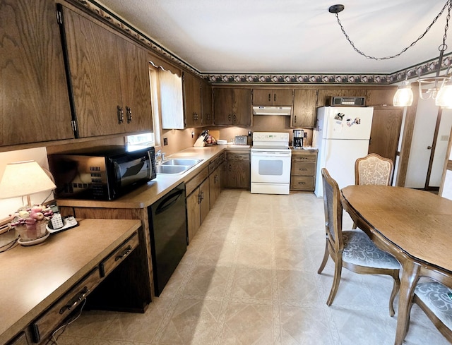 7331 175th Ave NW, Ramsey, MN 55303 - kitchen with black appliances, under cabinet range hood, a sink, dark brown cabinetry, and light flooring