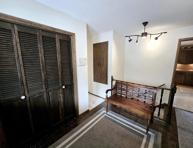 7331 175th Ave NW, Ramsey, MN 55303 - corridor featuring a textured ceiling and baseboards