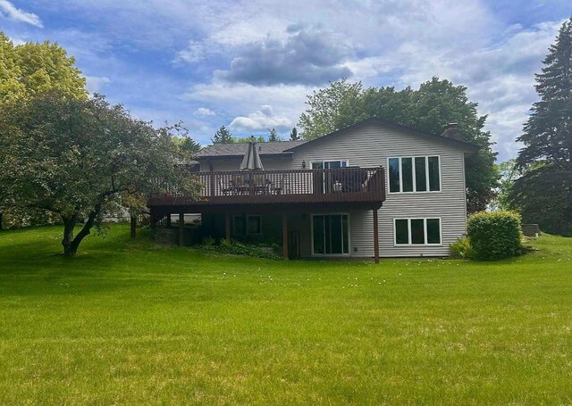 7331 175th Ave NW, Ramsey, MN 55303 - back of property with a deck, a yard, and a chimney