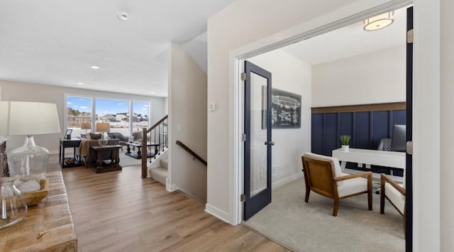 interior space featuring light wood-style floors, recessed lighting, and stairway