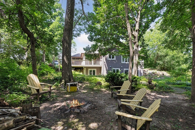 17180 Jordan Ct, Lakeville, MN 55044 - view of yard with an outdoor fire pit and a deck