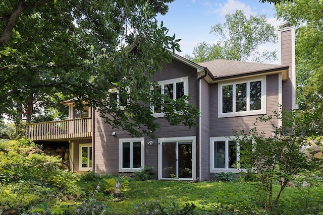 17180 Jordan Ct, Lakeville, MN 55044 - rear view of house featuring a chimney and a lawn