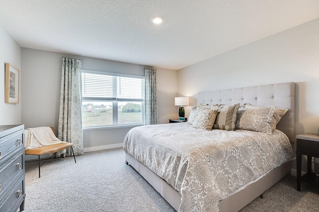 carpeted bedroom featuring baseboards