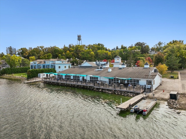 dock with a water view and view of scattered trees