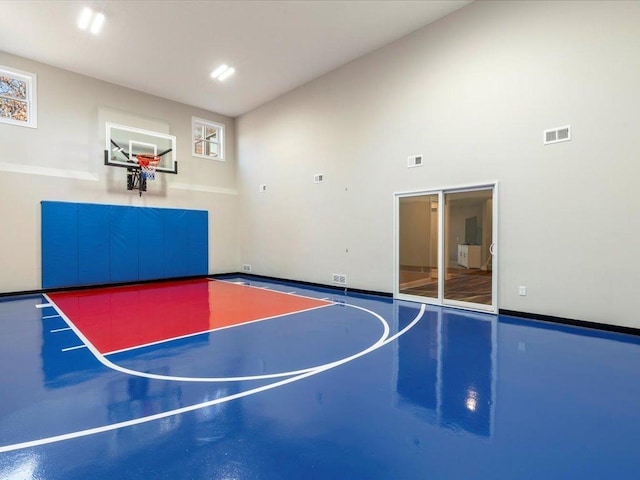 view of sport court with basketball hoop