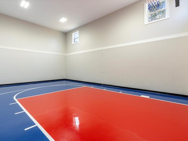 view of sport court featuring basketball hoop