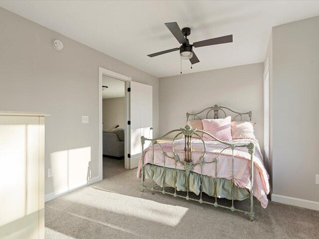 bedroom featuring carpet flooring, ceiling fan, and baseboards