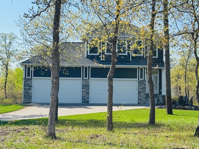 garage featuring concrete driveway