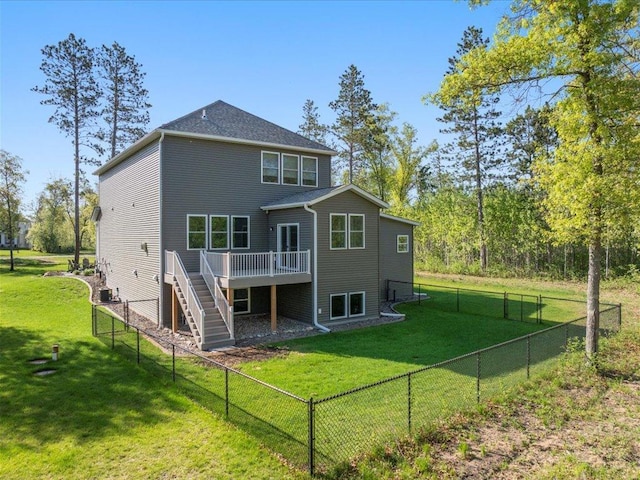 rear view of house featuring a wooden deck and stairs